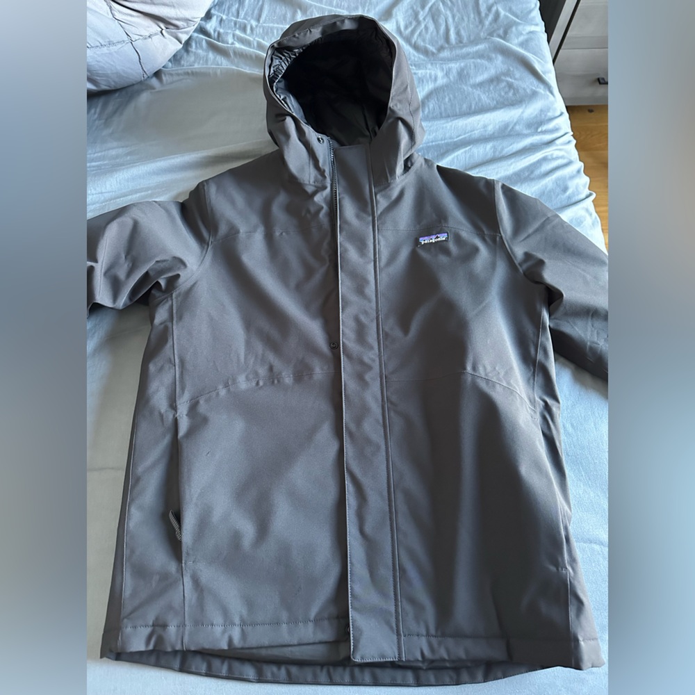 Patagonia black puffer jacket for boy XXL size. Great condition. Pretty warm